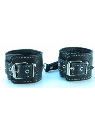 Чёрные кожаные наручники с крупной строчкой - БДСМ Арсенал - купить с доставкой в Москве