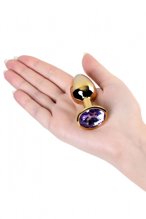 Золотистая коническая анальная пробка с фиолетовым кристаллом - 7 см. - ToyFa - купить с доставкой в Москве