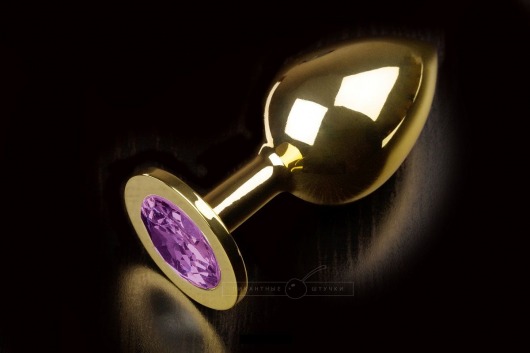 Большая золотая анальная пробка с закругленным кончиком и фиолетовым кристаллом - 9 см. - Пикантные штучки - купить с доставкой в Москве