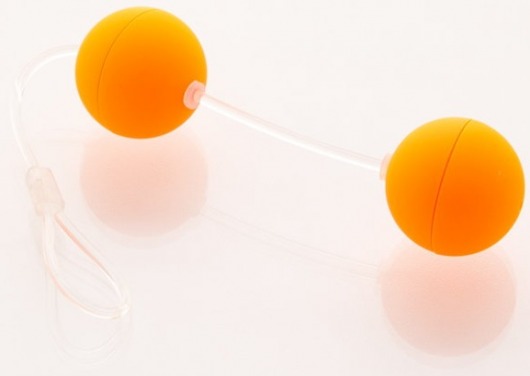 Оранжевые вагинальные шарики на прозрачной сцепке - Sexus